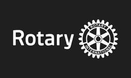 Rotary-Logo auf schwarzem Hintergrund mit weißem Text "Rotary" und weißem Zahnrad mit "Rotary International".